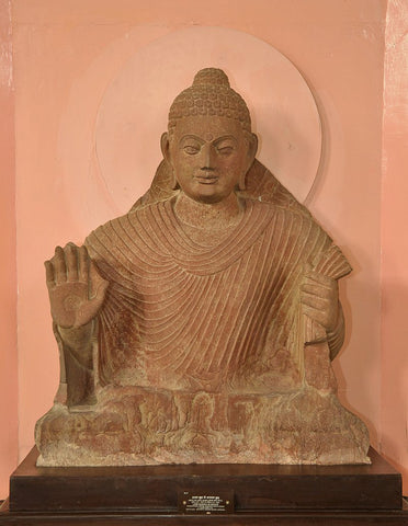 Buddha with right hand in abhaya mudra