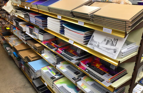 Display racks full of a plethora of sketchbooks