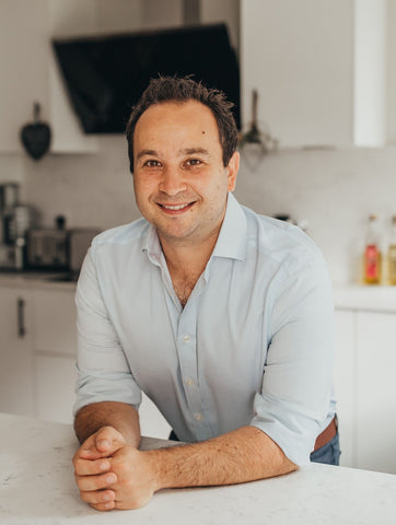 Photo of Adam Shaw at_dads_table in a white kitchen