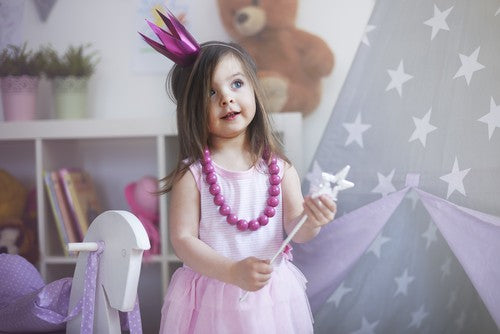 Little girl in dress-up clothes.