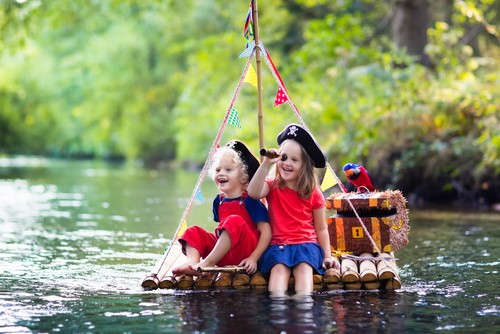 Kid Pirates playing on a raft