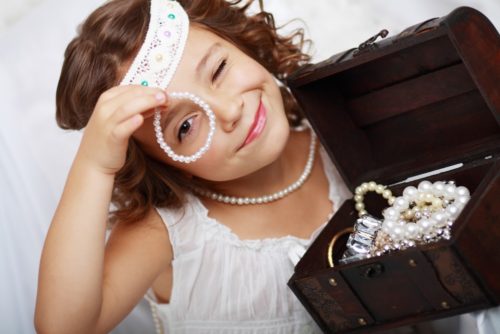 Little Girl Playing With Mom's Jewelry 