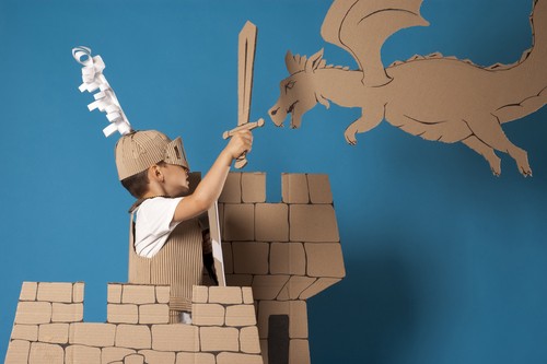 Boy Dressed as Knight in Cardboard Castle