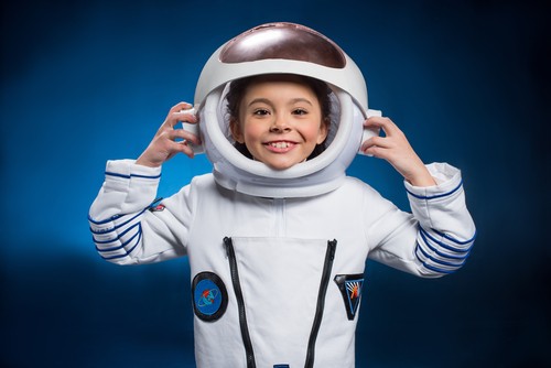 Little girl in astronaut suit