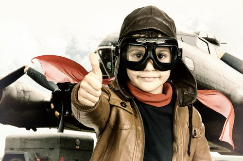 Boy dressed as a fighter pilot