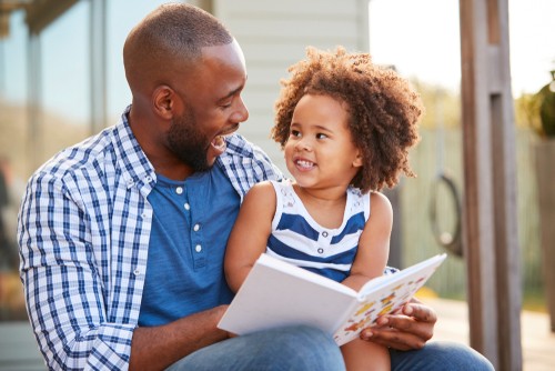 Father reading to his child