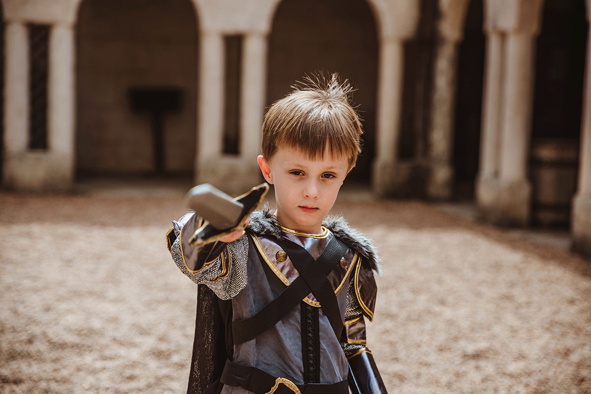 Child Playing in a Teetot Winter Knight Costume at a Castle - Photo by Kristy White