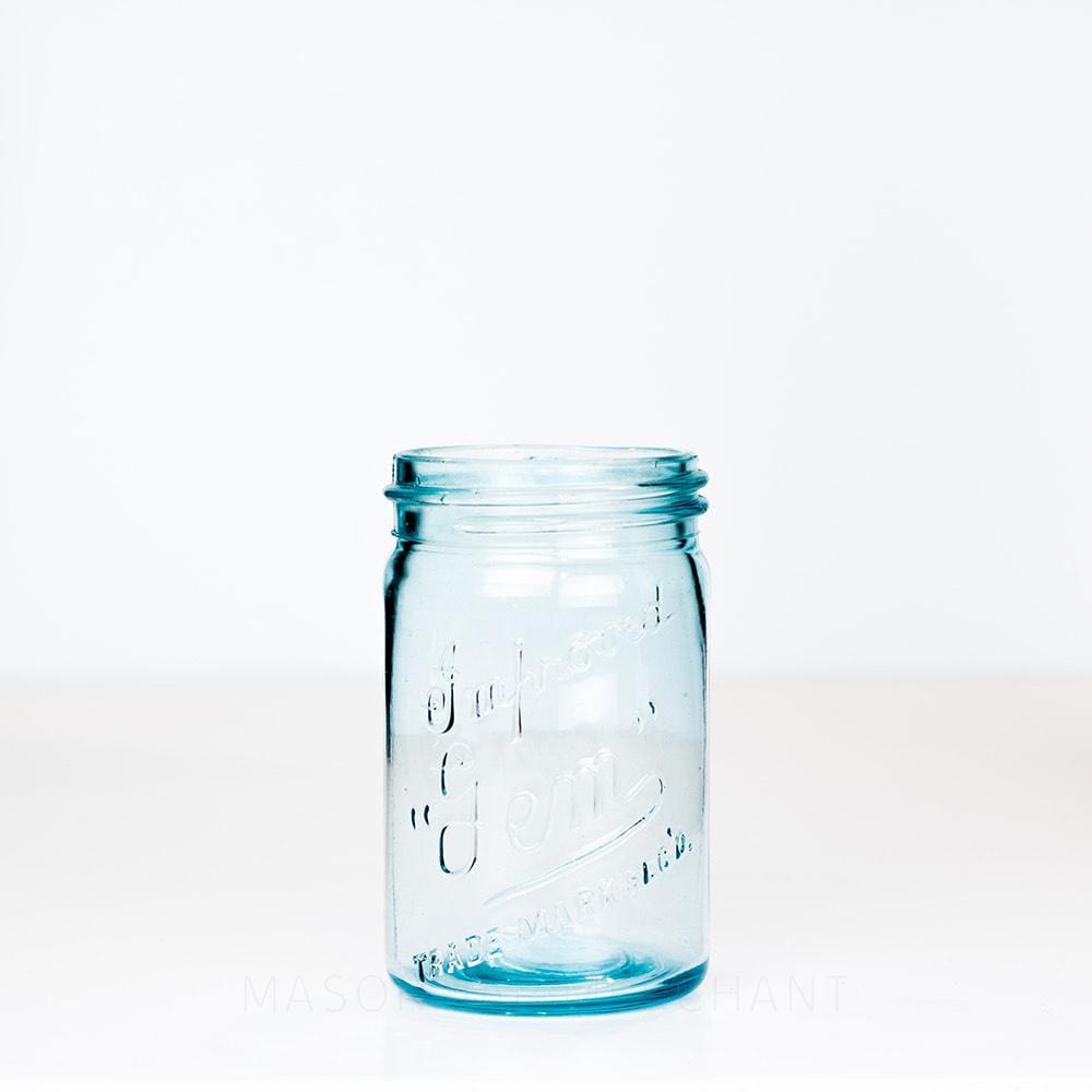 Vintage blue gem mouth pint mason jar with Improved Gem logo, on a white background 