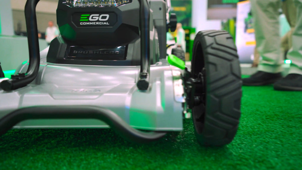 EGO Commercial 22-inch aluminum deck mower featuring height adjustment and peak power technology on display, emphasizing precision and performance