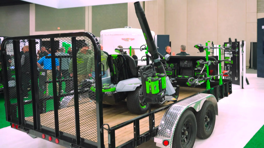 A fleet of EGO commercial outdoor power equipment showcased on a trailer, ready for professional landscaping, highlighting versatility and efficiency