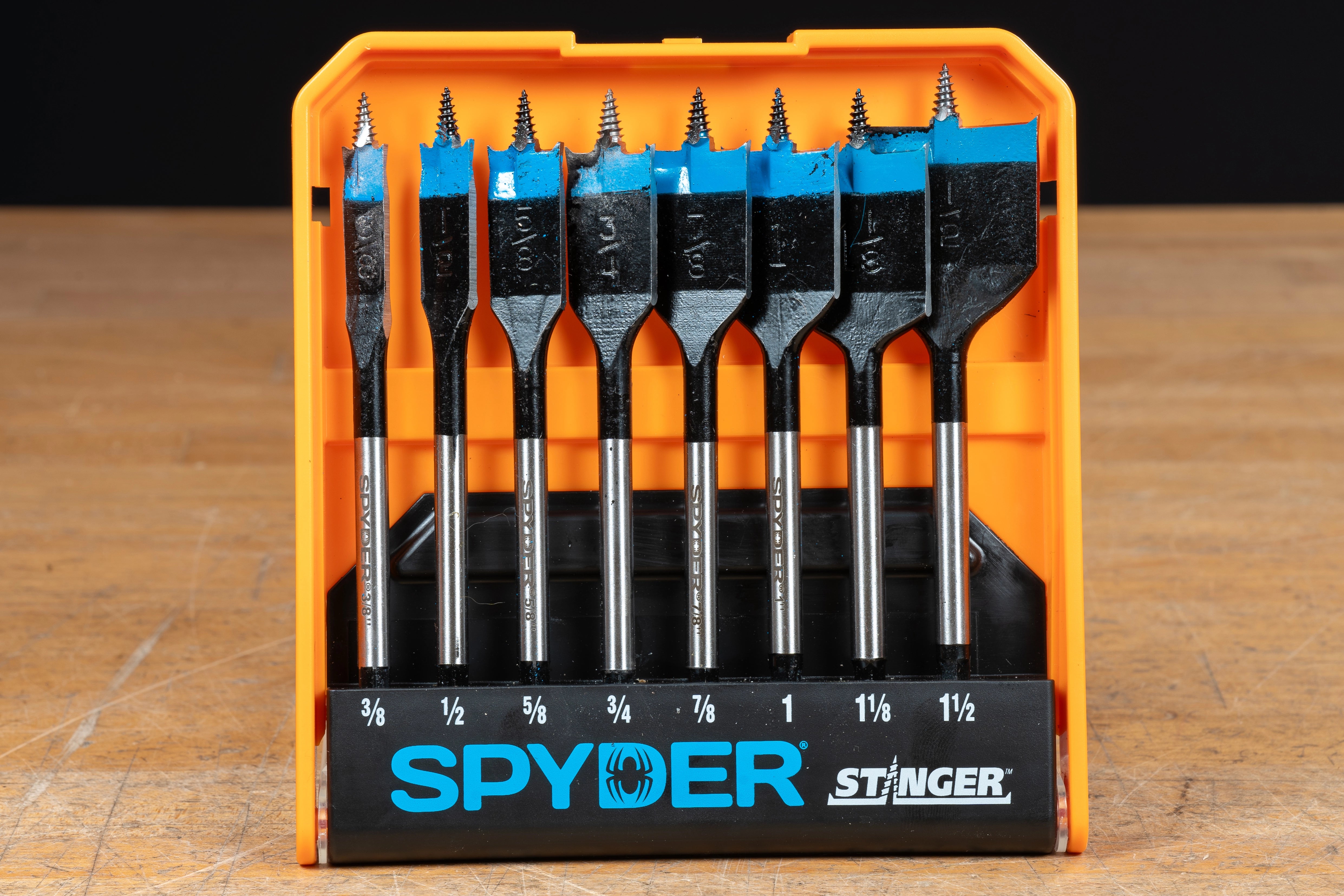 Spyder spade bit set neatly organized in an orange storage case