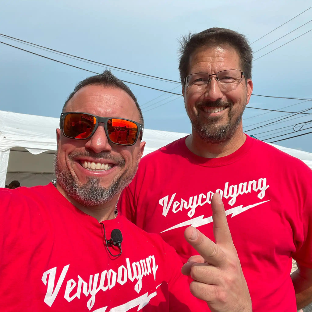 Vince and James in red VeryCoolGang shirts at Ohio Power Tool event, promoting limited-edition Thunderbolt T-shirt available at VCG store.