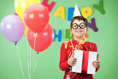 Happy Kid holding a birthday gift on Promo Codes page