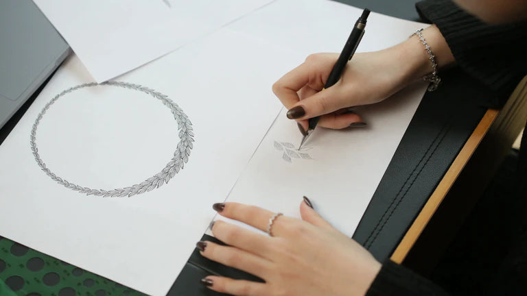 Designer working on an APM Monaco necklace design.