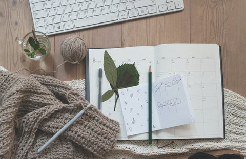 calendar with pen and pencil