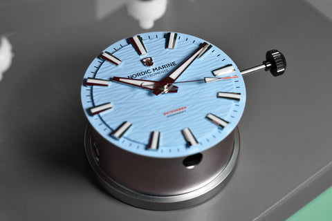 Setting hands on a watch dial watchmaking