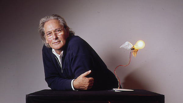 Ingo Maurer in 1998 with his iconic Lucellino Table Lamp