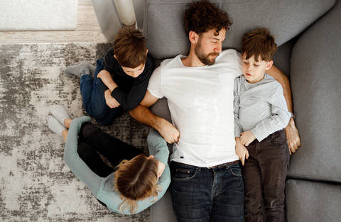 ID: Father and kids sitting quietly together