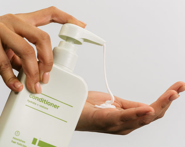 conditioner being pumped onto hand