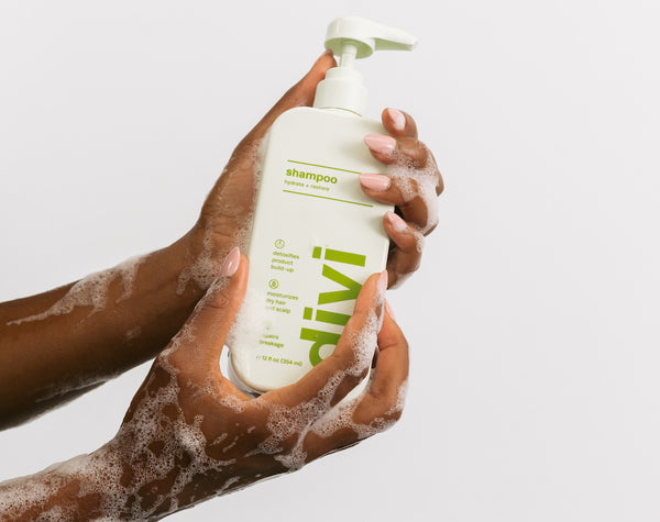 shampoo bottle being held in hands