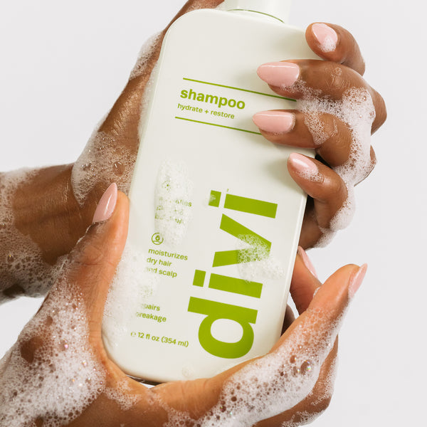 shampoo bottle being held in hands