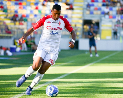 Walid Cheddira kicking soccer ball 