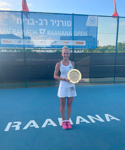 Polina Kudermetova holding trophy 