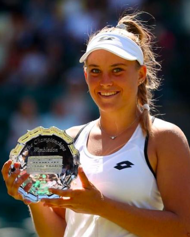 Luca Udvardy hodling trophy as the runner-up in the Girls’ Singles at Wimbledon 