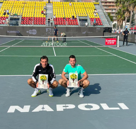 Austin Krajicek and Ivan Dodig holding trophies after winning the ATP 250 in Naples