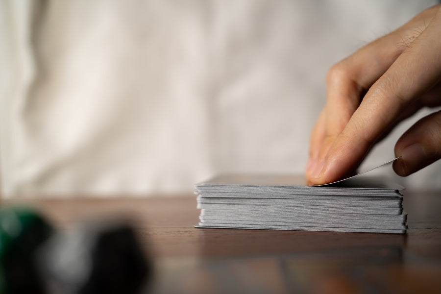 Hand drawing a card from a deck