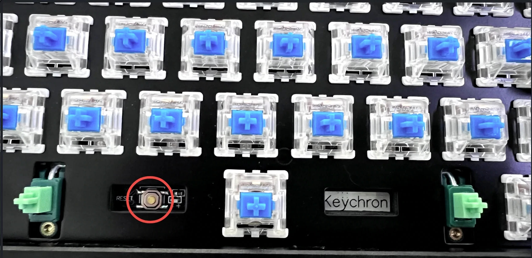 Remove the space bar keycap to find the reset button on the left side of the space bar switch on the PCB.