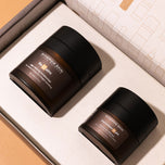 Synergie Skin products, ReClaim and ImprovEyes Night laying side by side, inside of the Overnight Renewal Duo packaging.