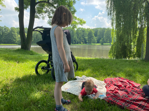 Girl with sister at picnic
