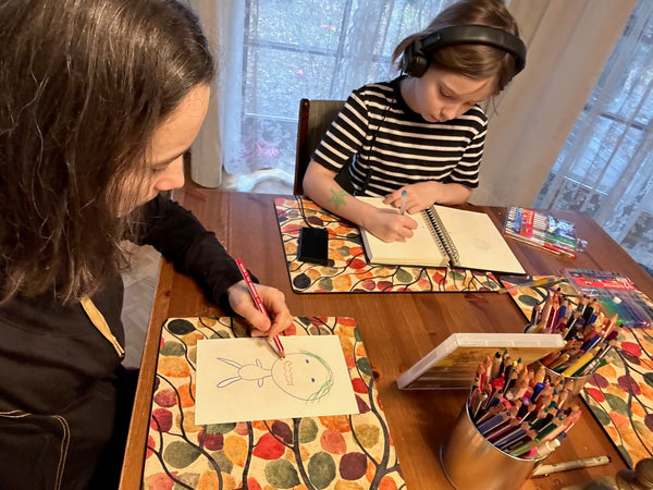 Mother and daughter drawing emotions. 