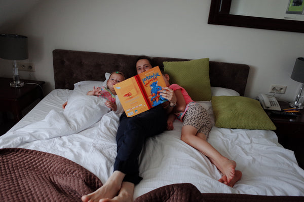 Family reading a book.