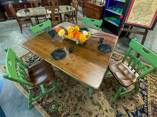 Custom Painted Green and Wood Farmhouse Dining set with 4 chairs and a floral display