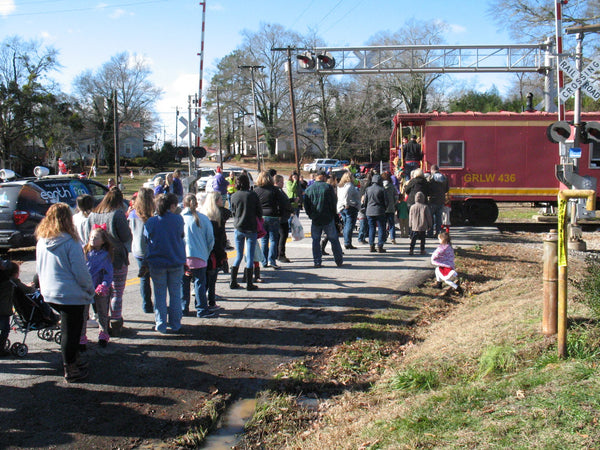 Photo taken from Standpipe Antique parking lot showing crowd lined up waiting for the Santa Train in 2019