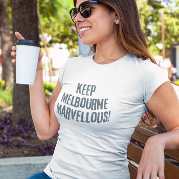 Woman on a park bench with a cool Keep Melbourne Marvellous T-shirt saying "Keep Melbourne Marvellous!"