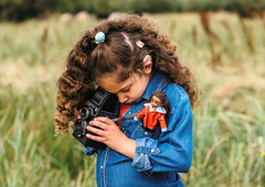 girl with Mia wildlife photographer doll