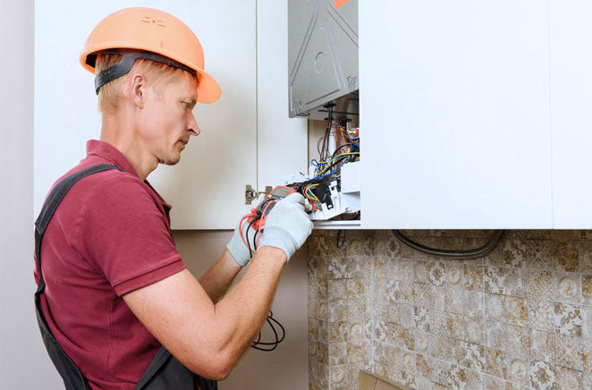 A worker checking the insulation level of the house