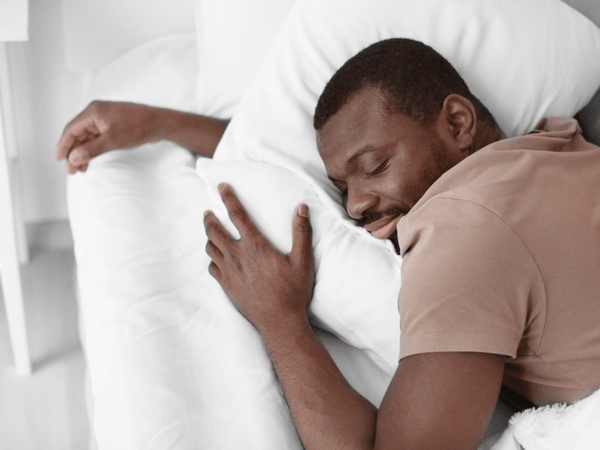 man sleeping after taking CBD tincture
