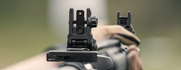 Shooters view of Magpul MBUS 3 Rear Sight and MBUS 3 Front Sight showing serrations on flip aperture