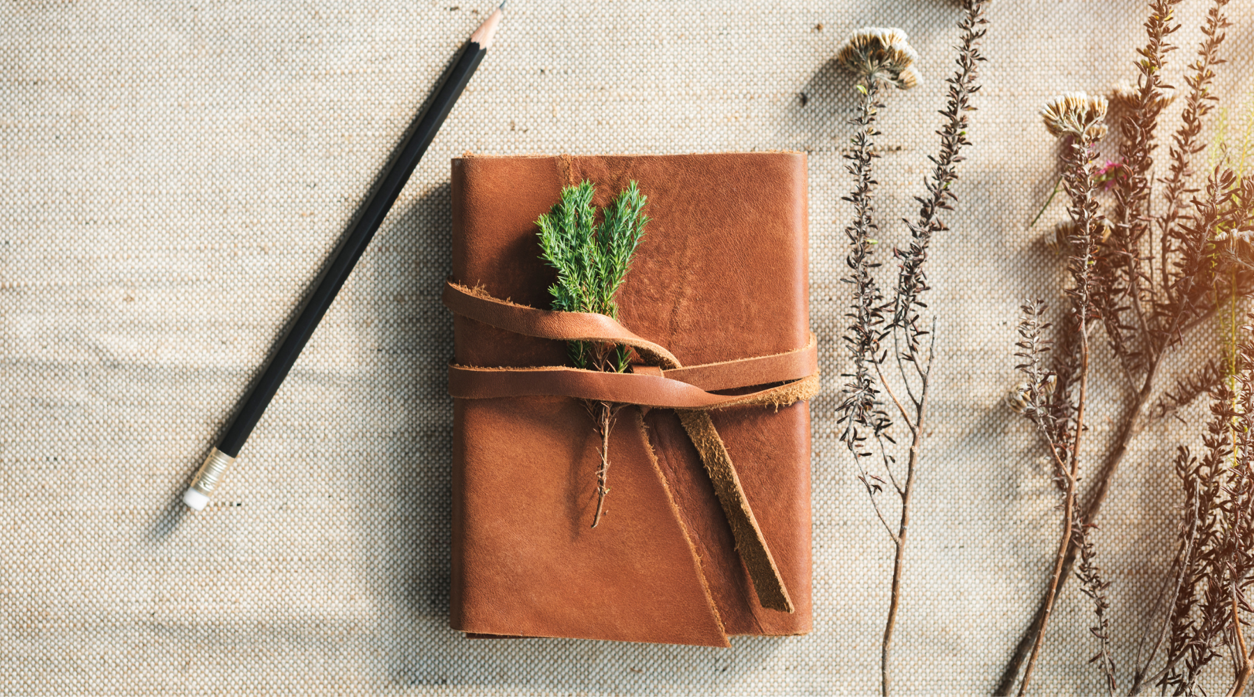 diary, journal, book, herbs, dry flowers, pencil, journal on a table