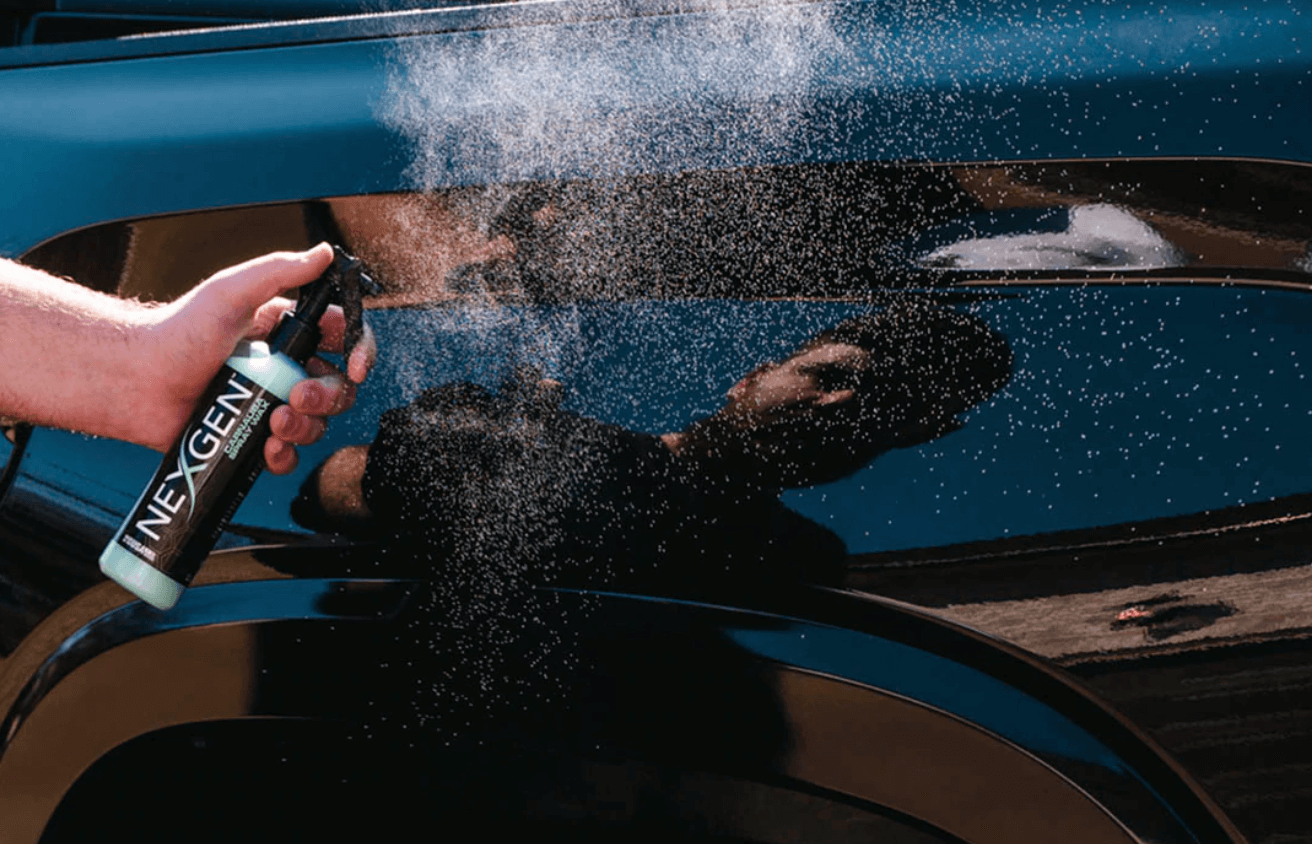 man using carnauba car wax