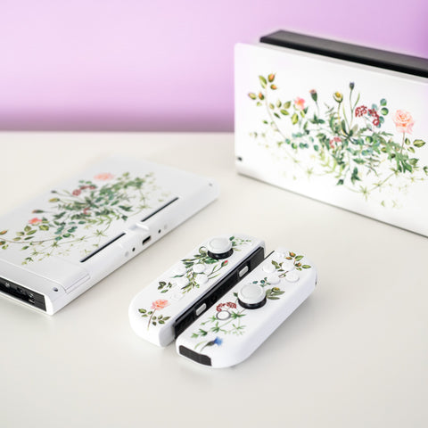 Nintendo Switch OLED with floral print.