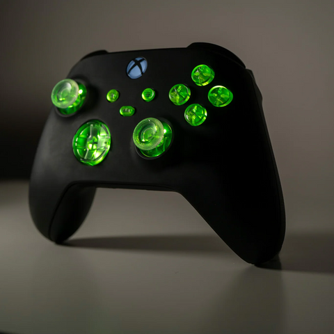Black Microsoft Xbox controller with clear LED backlit buttons.