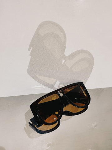 Sunglasses in brown with orange tinted lens