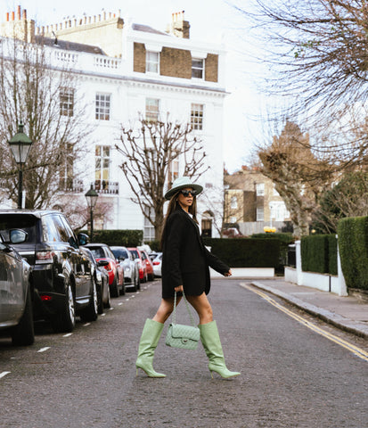 Kiran in green fedora and green quilted bag