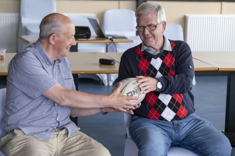 Sporting Memories - 2 club members holding rugby ball