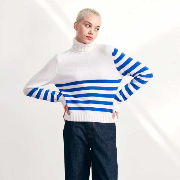 Model wearing cashmere jumper in blue and white with invert stripes